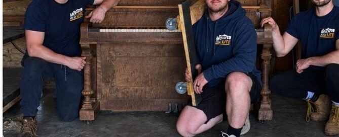 Move Lite piano moving crew with antique upright piano in St. Louis MO