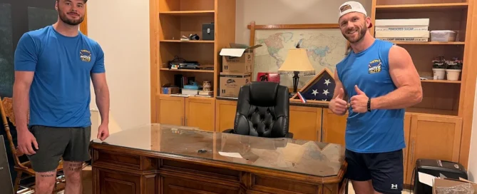 Two Move Lite movers with a large executive desk in St. Louis MO
