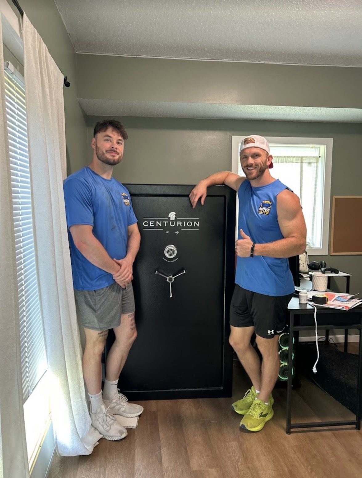 Move Lite crew repositioning a gun safe inside a Chesterfield MO home